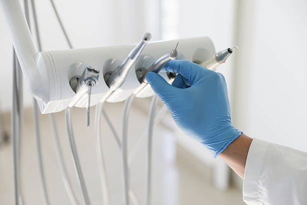 Professional Tooth Extraction technician working in Grundy County County, IL
